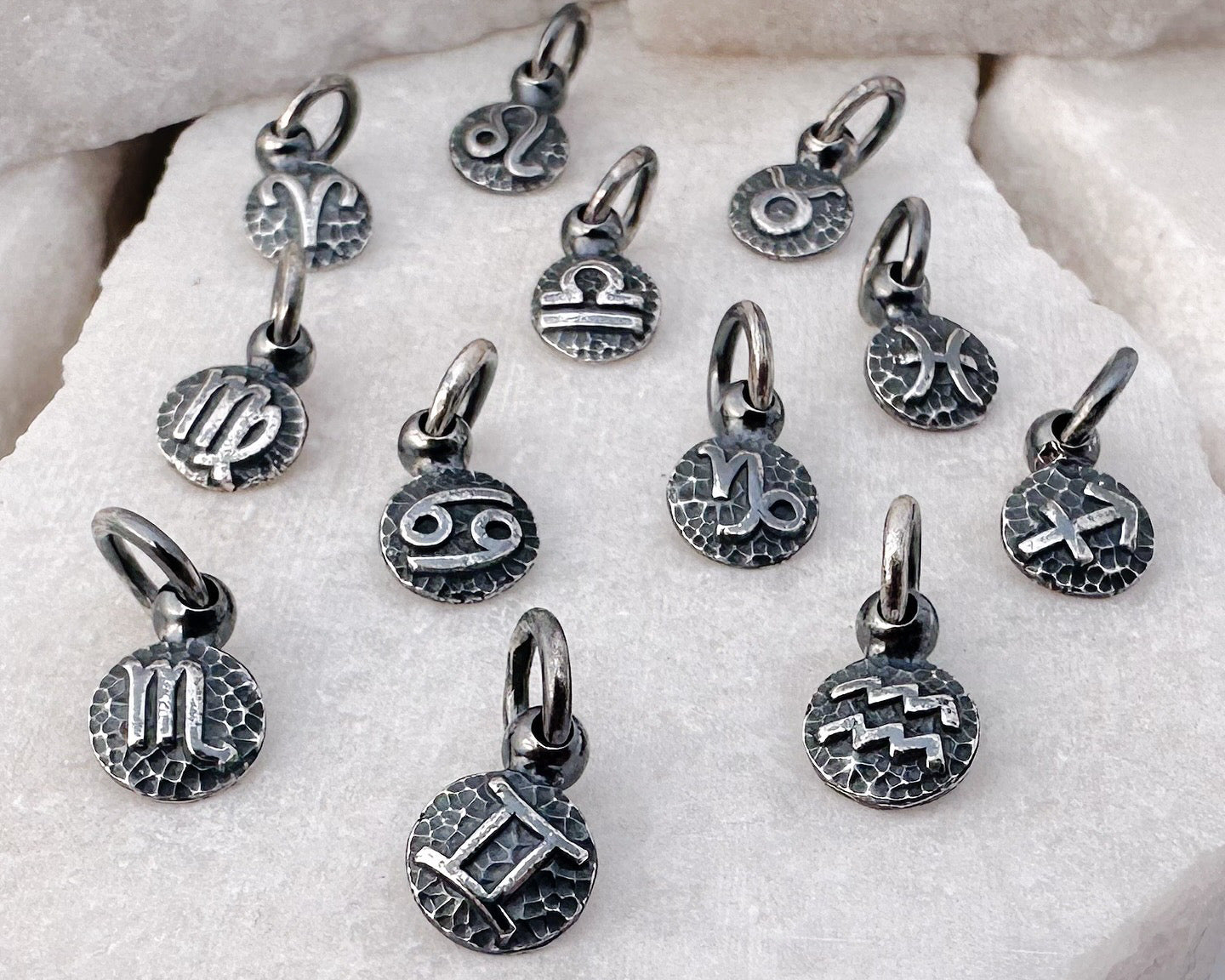 Handmade recycled sterling silver zodiac charms