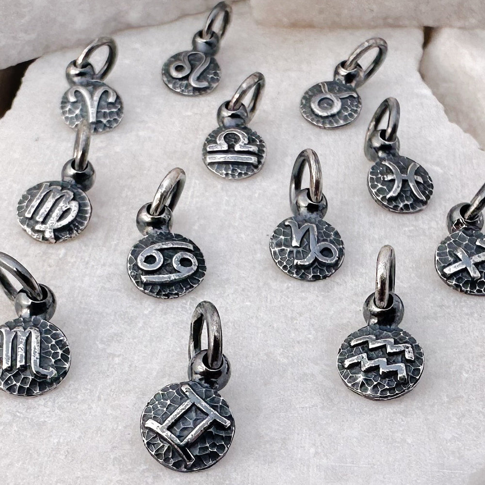 
                  
                    Handmade recycled sterling silver zodiac charms
                  
                