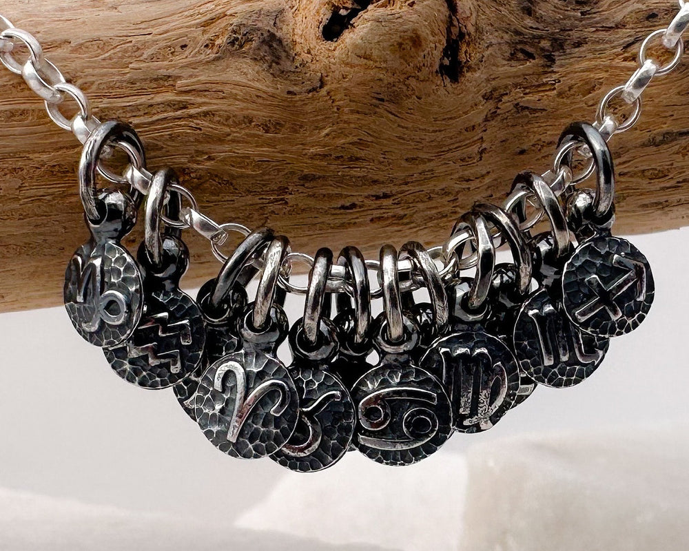 
                  
                    Handmade recycled zodiac charms on chain
                  
                