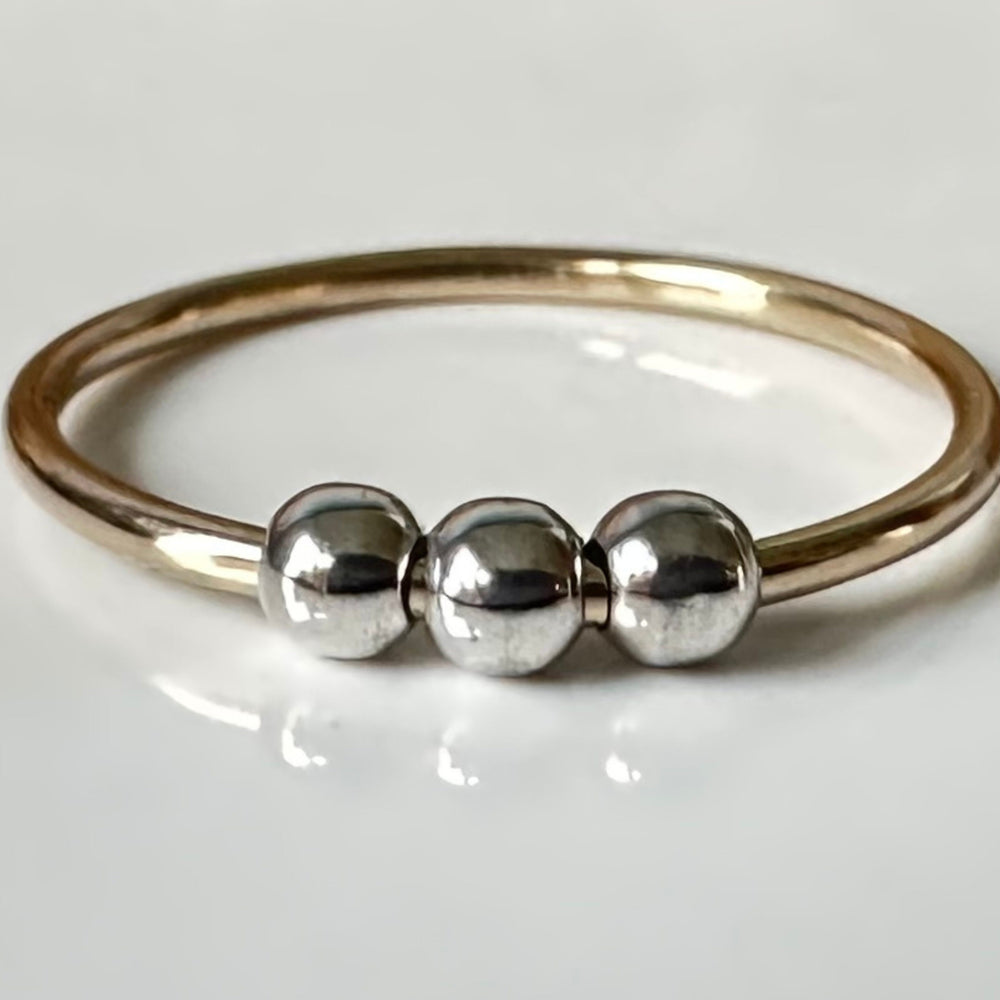 
                  
                    Fidget Ring Handmade from 9ct Gold and Sterling Silver Beads, 1.2mm Gold Stackable Ring Band, Anxiety Ring, Spinner Ring
                  
                