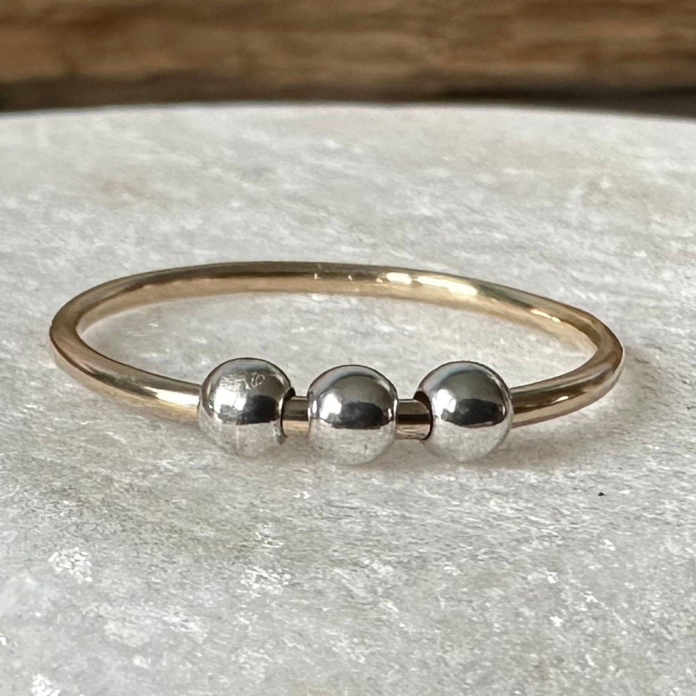 
                  
                    Fidget Ring Handmade from 9ct Gold and Sterling Silver Beads, 1.2mm Gold Stackable Ring Band, Anxiety Ring, Spinner Ring
                  
                