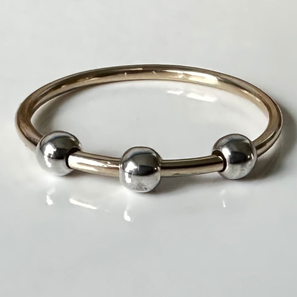 
                  
                    Fidget Ring Handmade from 9ct Gold and Sterling Silver Beads, 1.2mm Gold Stackable Ring Band, Anxiety Ring, Spinner Ring
                  
                