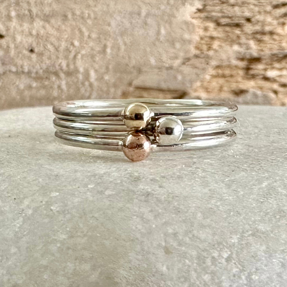 
                  
                    Set of Three Stacking Rings, Solid 9ct Yellow Gold Dot, Solid 9ct Rose Gold Dot, 925 Sterling Silver Dot on 1.3mm 925 Sterling Silver Ring
                  
                