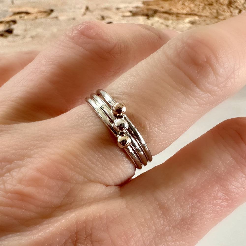 
                  
                    Set of Three Stacking Rings, Solid 9ct Yellow Gold Dot, Solid 9ct Rose Gold Dot, 925 Sterling Silver Dot on 1.3mm 925 Sterling Silver Ring
                  
                
