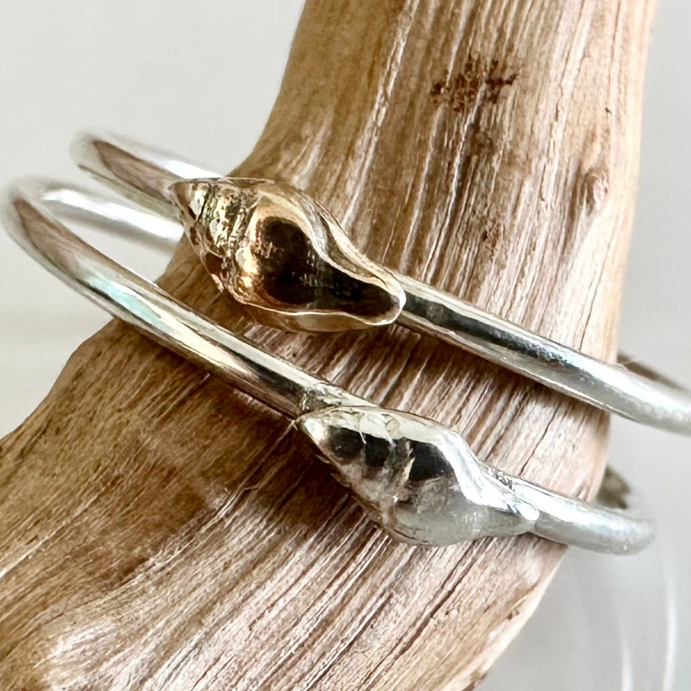
                  
                    Whelk Shell Stacking Ring, Solid 9ct Gold or Sterling Silver Shell on a 1.2mm 925 Sterling Silver Ring Band, Seashell Ring
                  
                